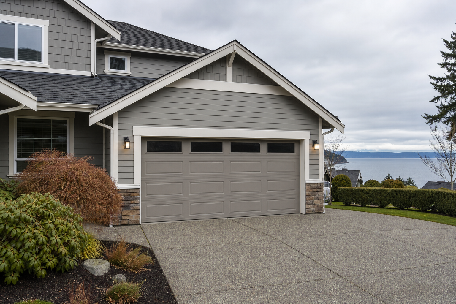 Suburban Mukilteo garage exterior with a closed garage door on an overcast day